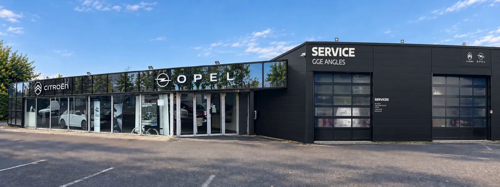 Façade du Garage Angles à L'Union avec ses enseignes Citroën, Opel et Service